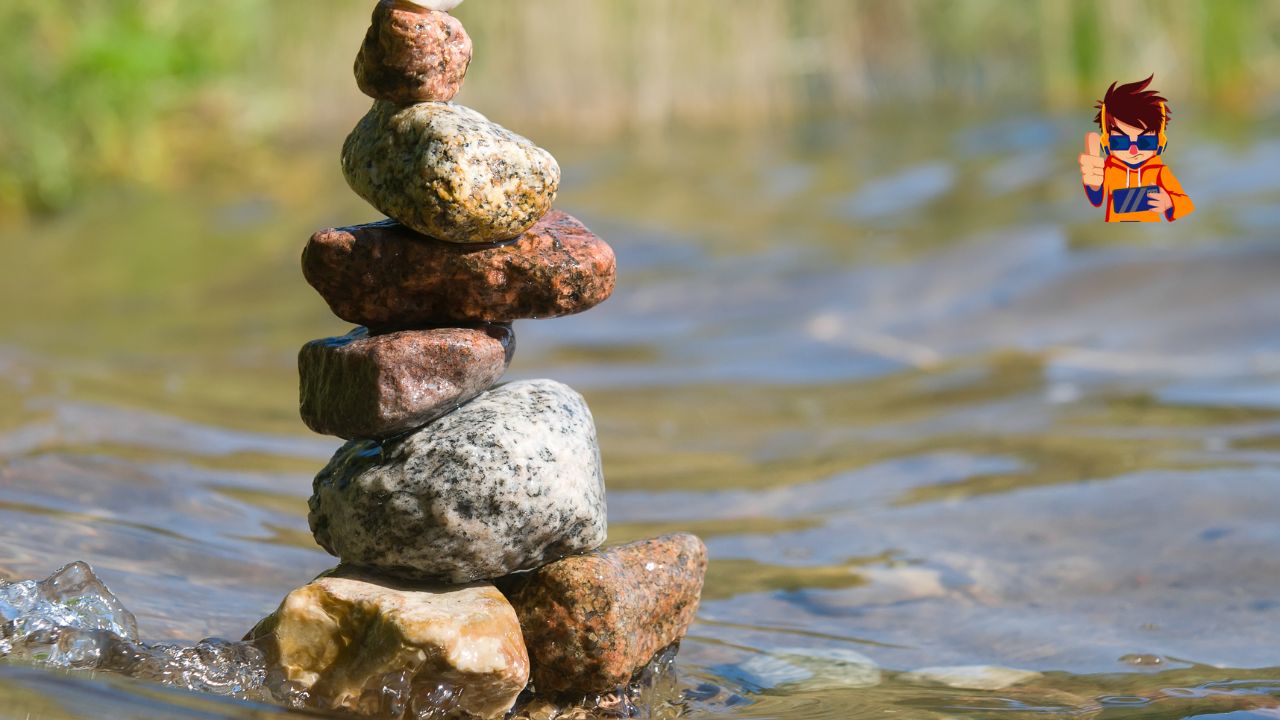 A balanced stack of colorful stones in a shallow stream, symbolizing stability, persistence, and harmony amidst flowing water.
